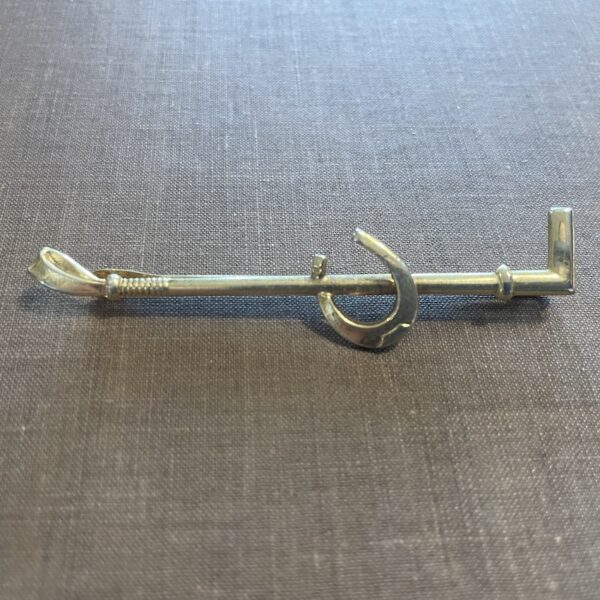 Horse shoe and whip tie clip